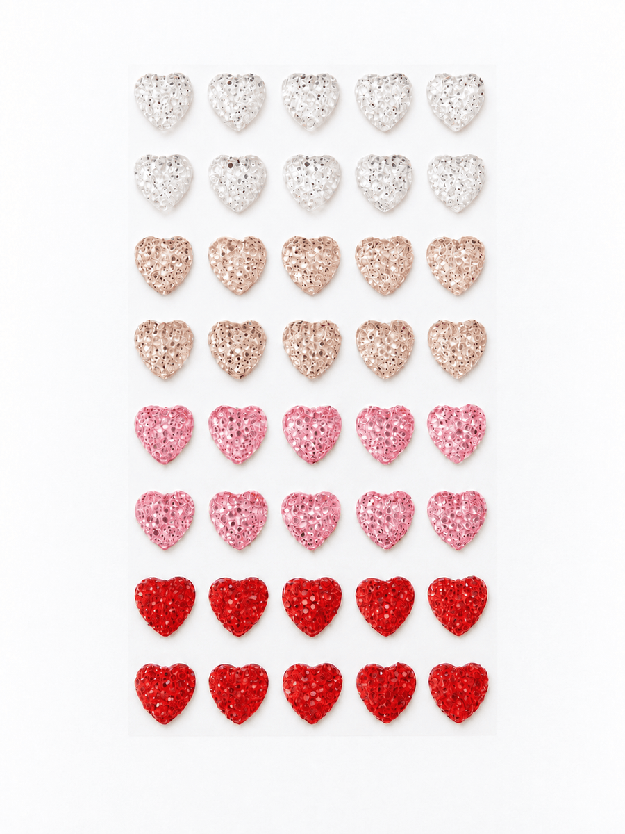 Ark med 40 selvklebende glitterhjerter i rødt, rosa, champagne og sølv